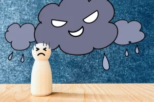 雨の日の頭痛で体調が悪い女性